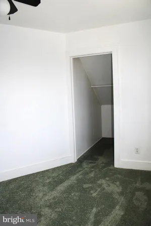 a bathroom with a glass door and shower