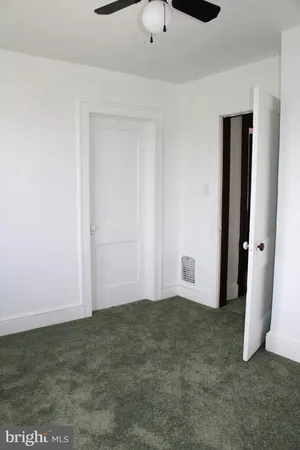 a bathroom with a sink toilet and mirror