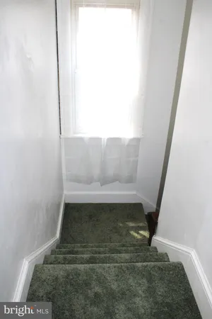 a view of empty room with windows