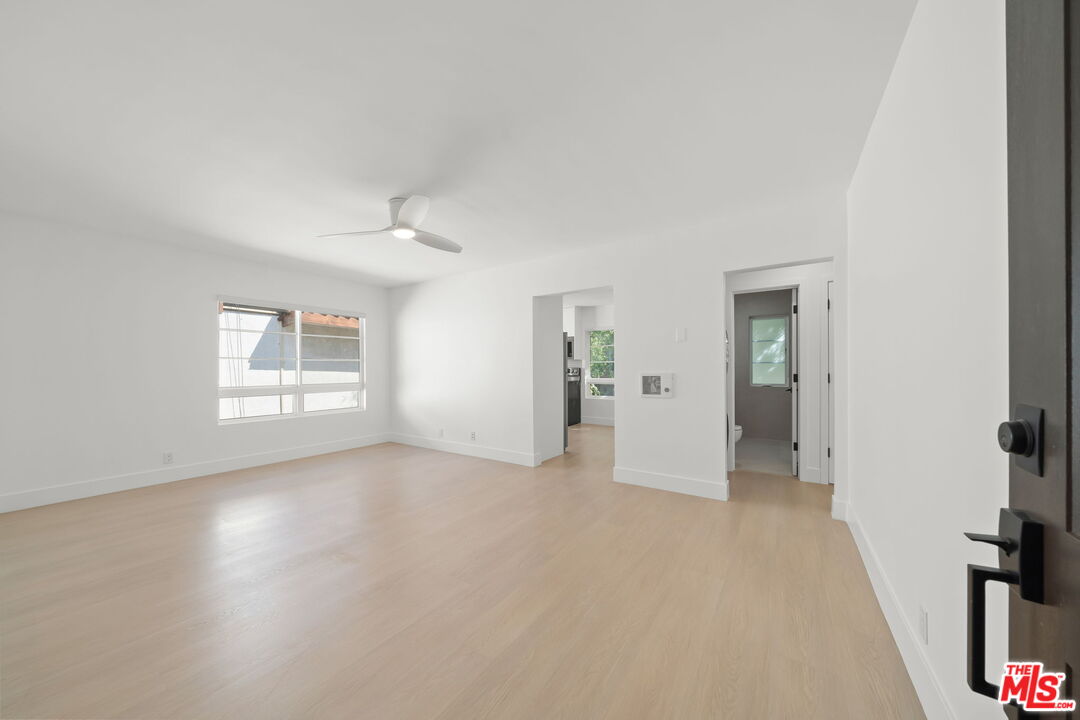 1201 Ohio Avenue, Unit 4 Long Beach, CA 90804 - Photo 2 of 18 an empty room with windows and closet