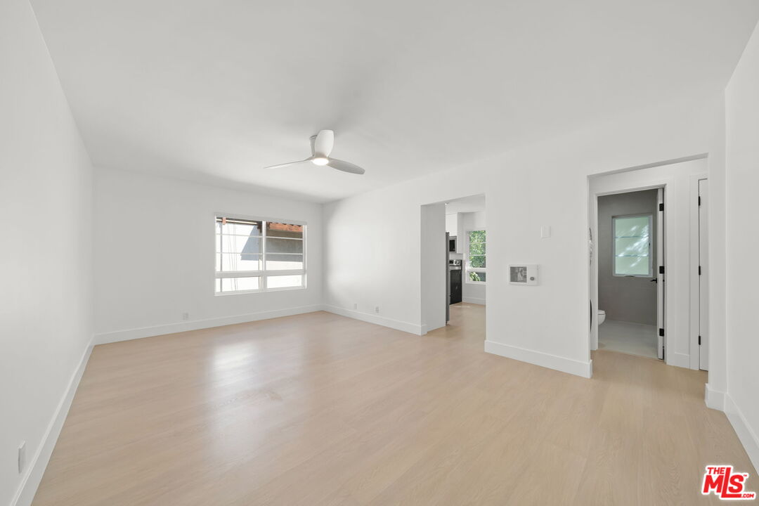 1201 Ohio Avenue, Unit 4 Long Beach, CA 90804 - Photo 3 of 18 wooden floor in an empty room and a window