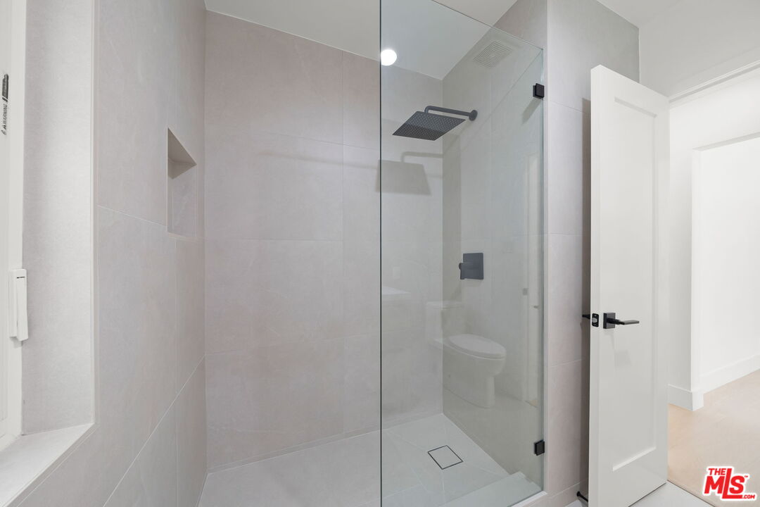 1201 Ohio Avenue, Unit 4 Long Beach, CA 90804 - Photo 10 of 18 a bathroom with a shower and toilet