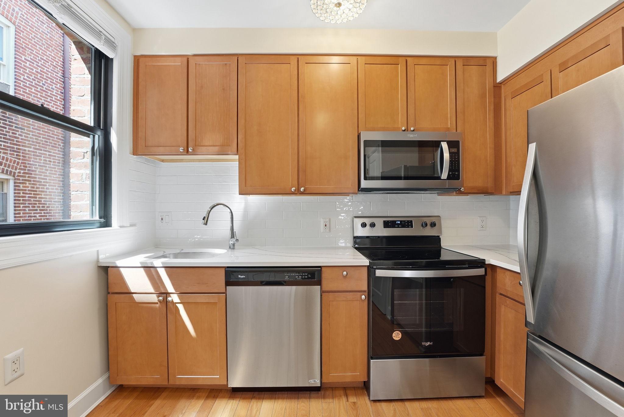 1858 California Street Northwest, Unit 33 Washington, DC 20009 - Photo 26 of 31 New Quartz Countertops and Subway Tiling
