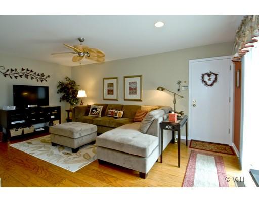 2035 Forest Ridge Road St. Charles, IL 60174 - Photo 8 of 16 a living room with furniture and a flat screen tv