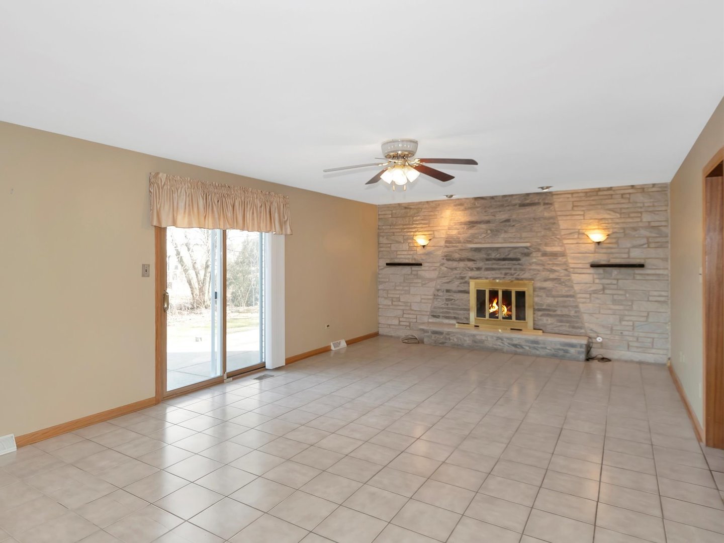 14501 South Abbott Road East Homer Glen, IL 60491 - Photo 13 of 31 an empty room with windows and fireplace