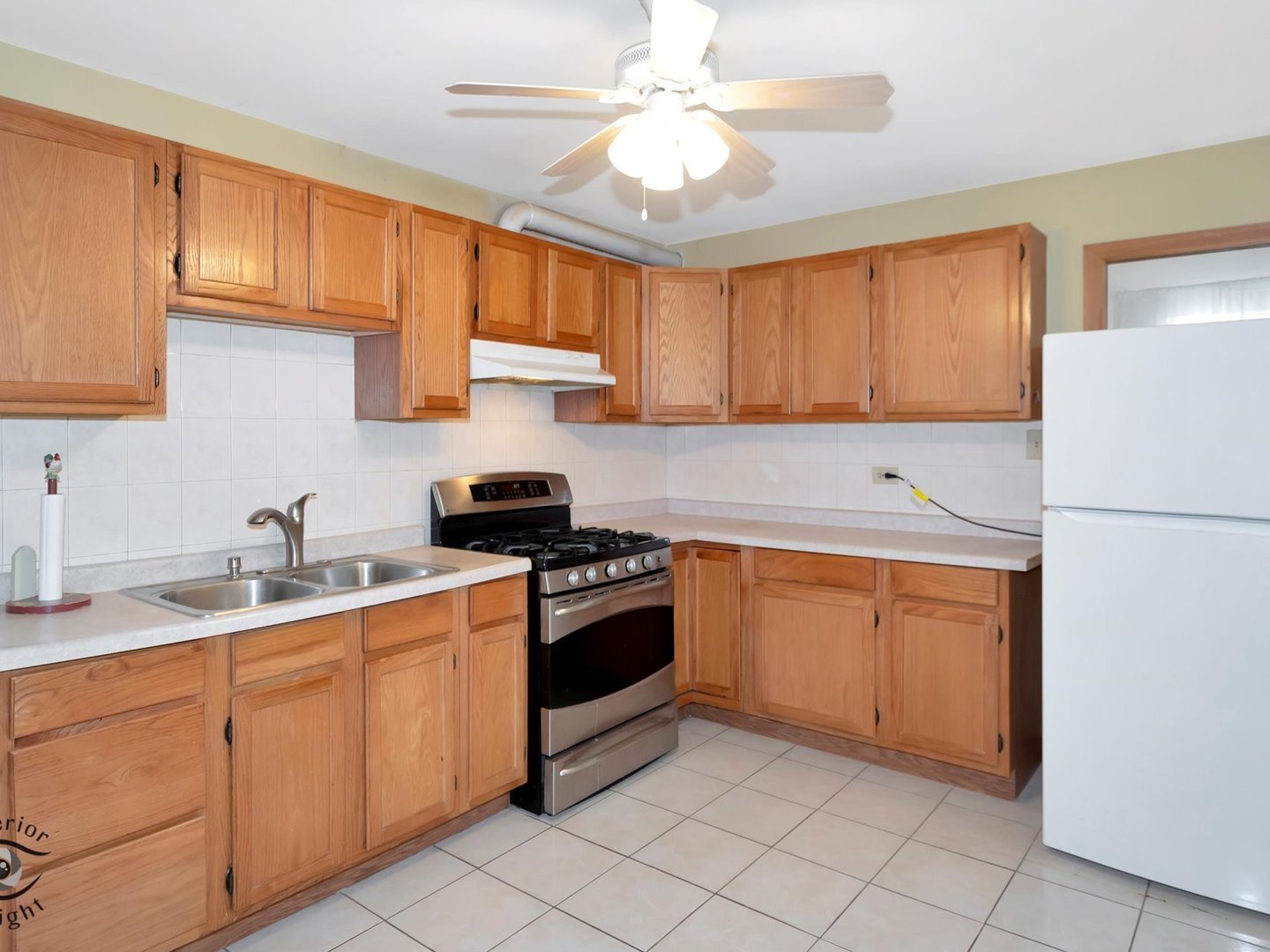 14501 South Abbott Road East Homer Glen, IL 60491 - Photo 15 of 31 a kitchen with stainless steel appliances granite countertop a sink stove and refrigerator