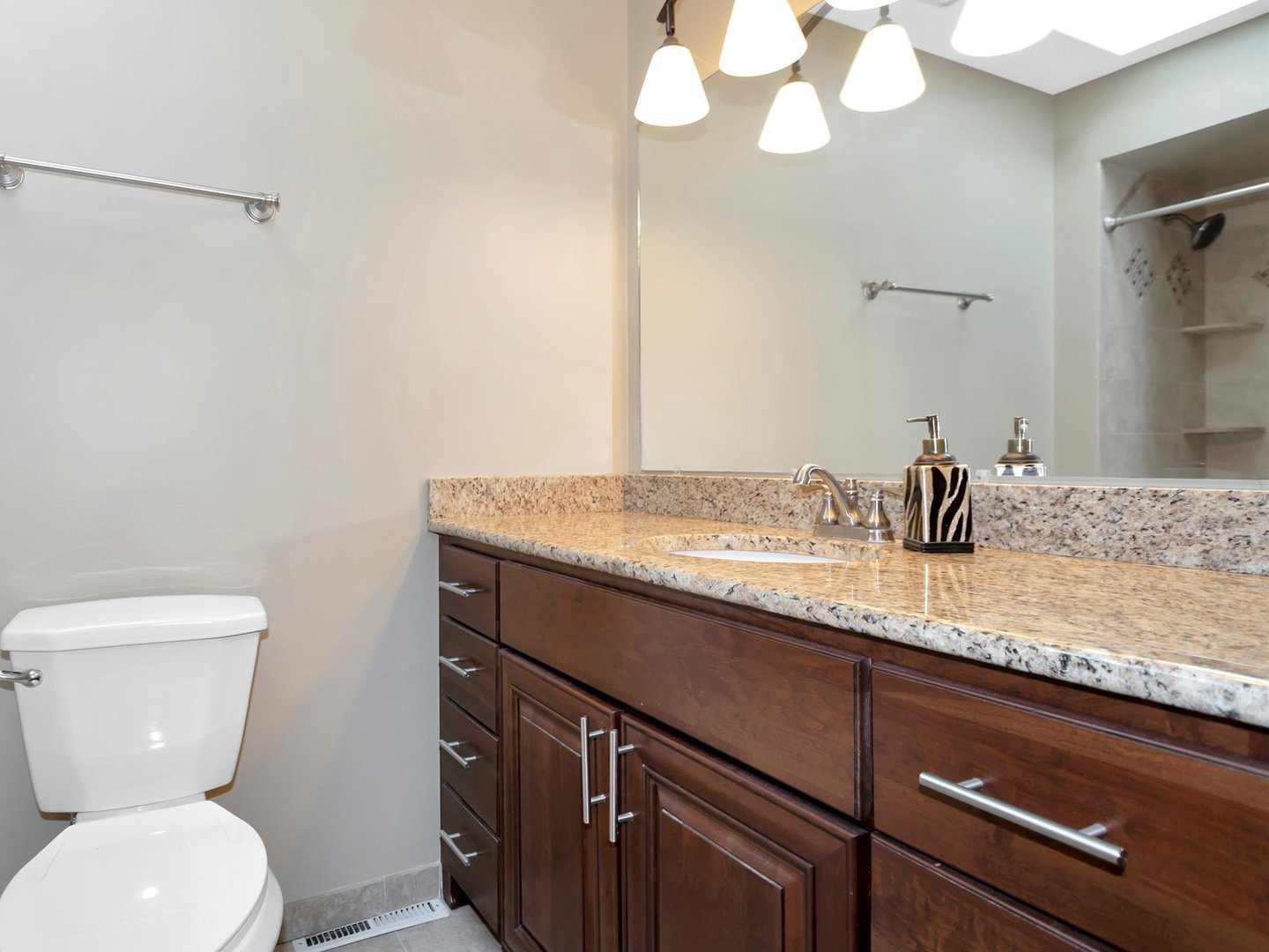 14501 South Abbott Road East Homer Glen, IL 60491 - Photo 21 of 31 a bathroom with a granite countertop sink a toilet and a mirror
