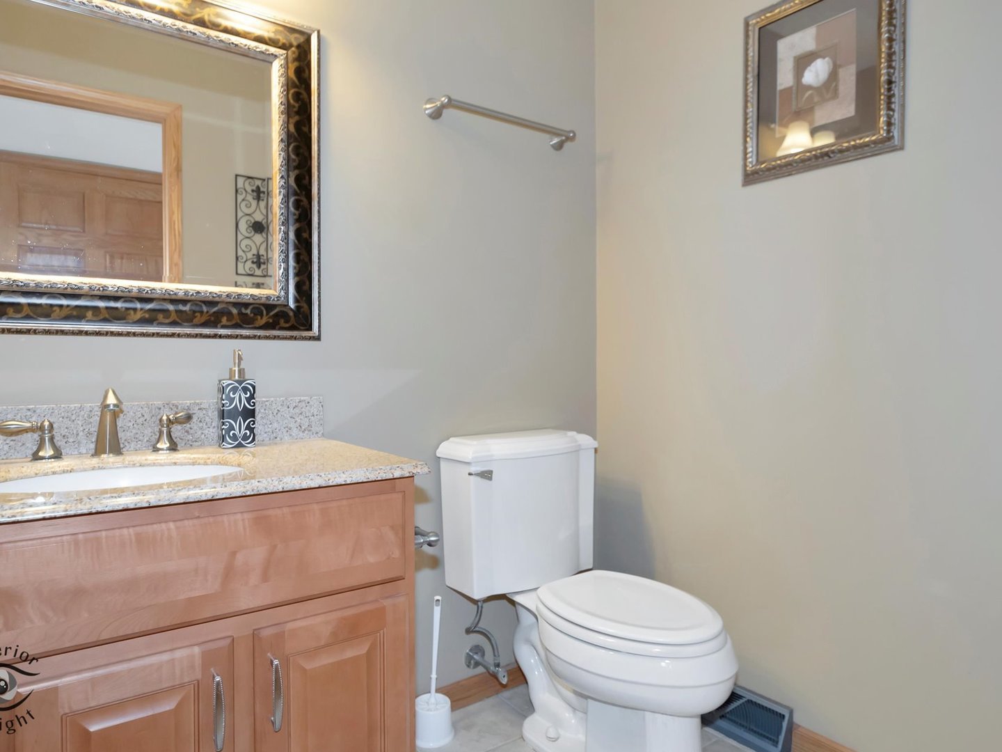 14501 South Abbott Road East Homer Glen, IL 60491 - Photo 23 of 31 a bathroom with a toilet sink vanity and mirror