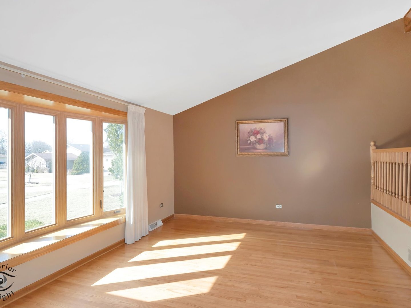 14501 South Abbott Road East Homer Glen, IL 60491 - Photo 3 of 31 a view of an empty room with a window and wooden floor