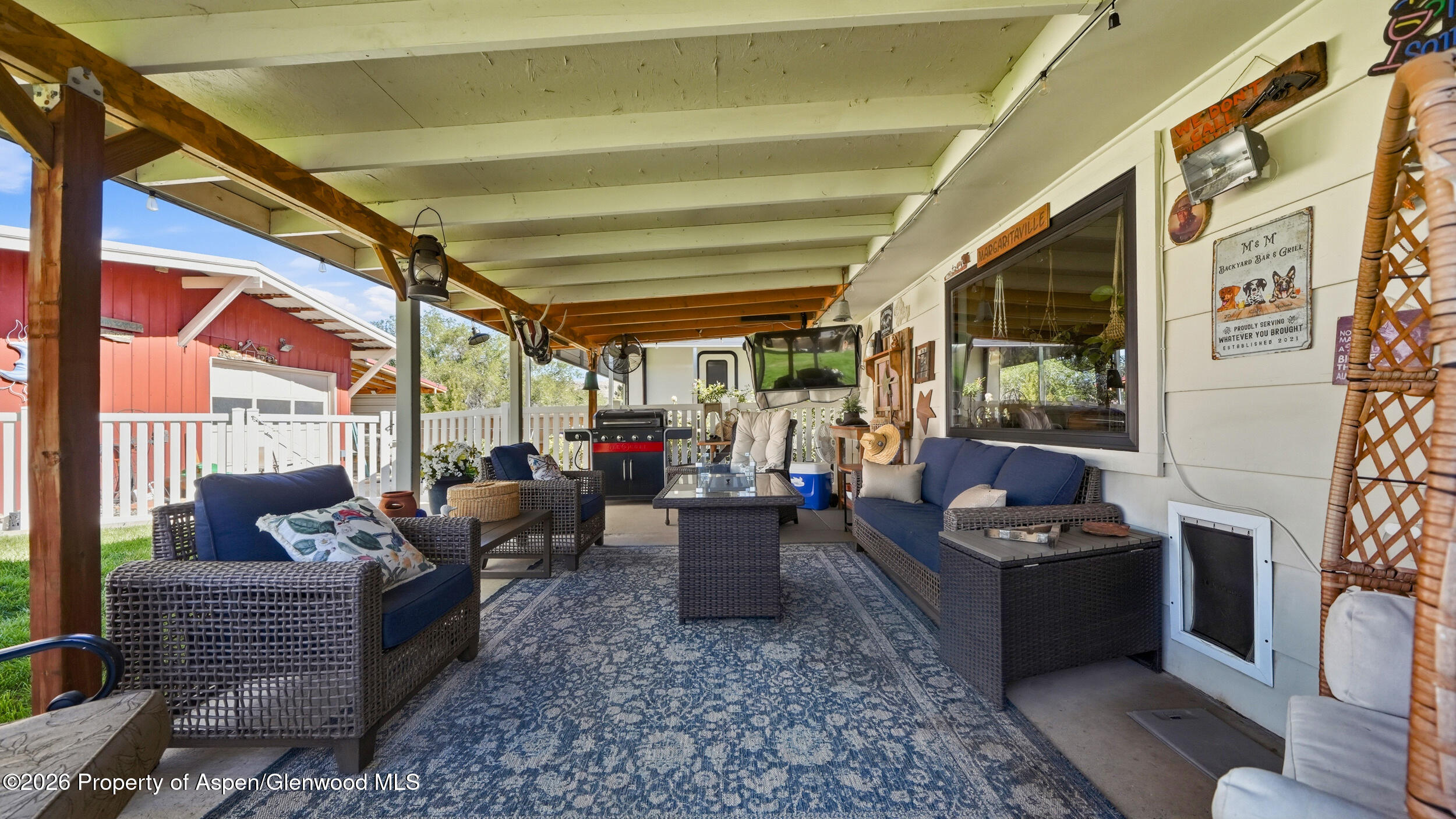 445 South Camp Road Grand Junction, CO 81507 - Photo 25 of 37 a living room with furniture and a floor to ceiling window