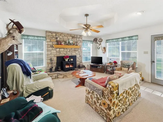 a living room with furniture fireplace and a fireplace