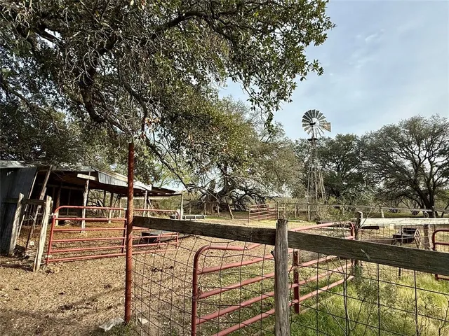 a view of a balcony with trees