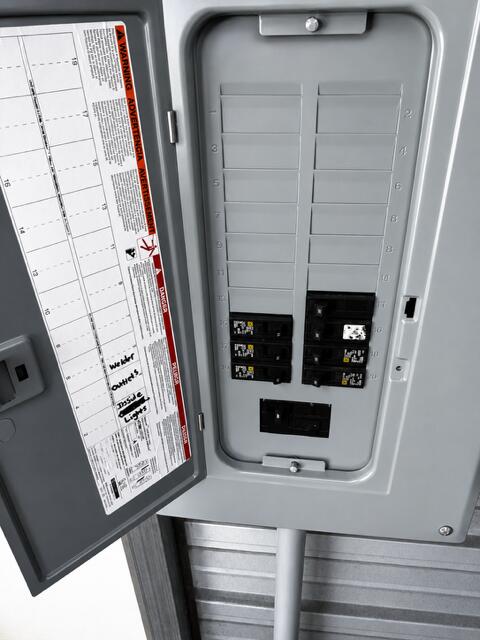 3124 Shaw Road Manning, SC 29102 - Photo 9 of 21 Interior view of the electrical panel showing multiple installed breakers for the shop’s lighting, outlets, and equipment circuits.