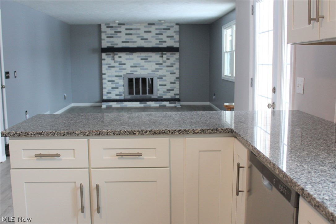 6791 Orchard Trail Road Northeast Canton, OH 44721 - Photo 12 of 27 kitchen to family room