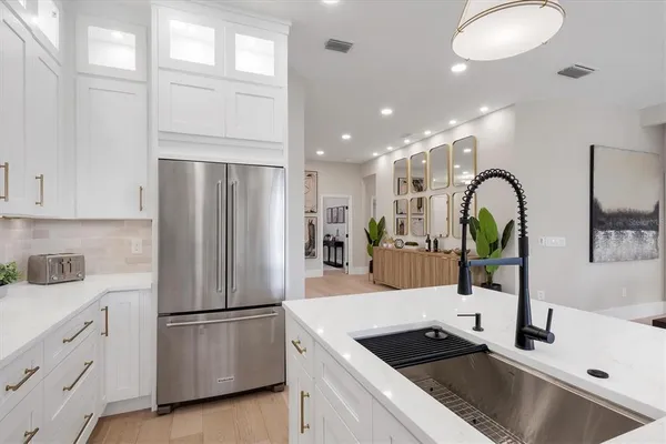a kitchen with counter top space a sink and cabinets