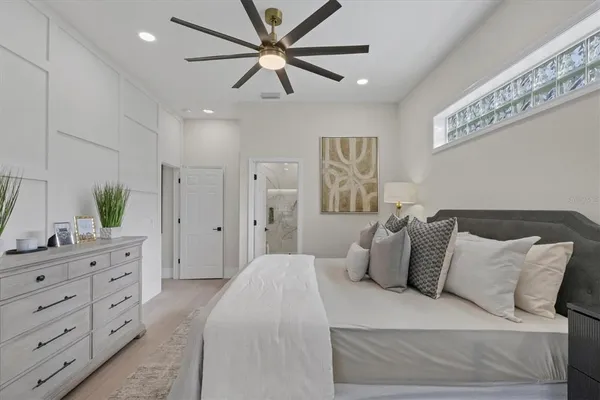 a bedroom with a bed and a window