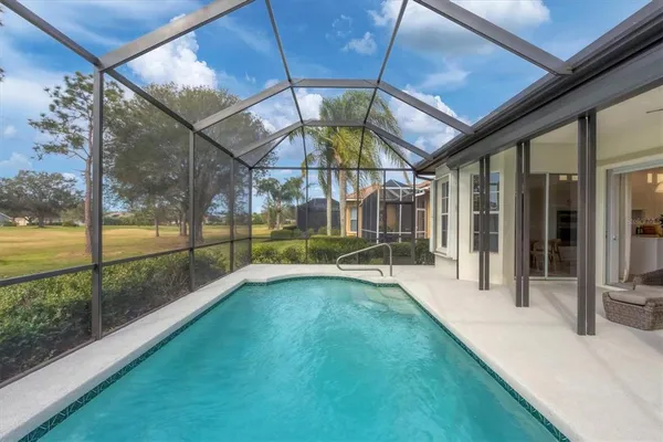 a view of a house with a yard porch and sitting area