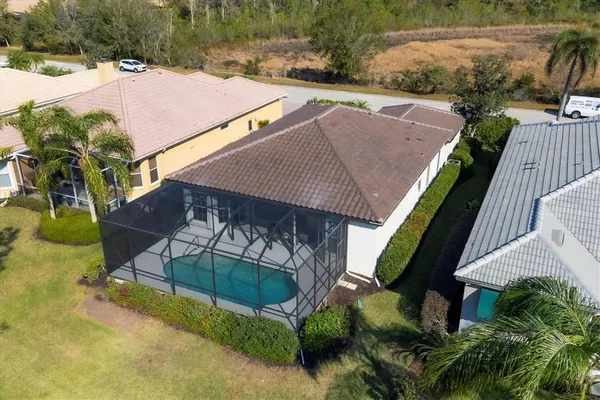 an aerial view of a house with a lake view