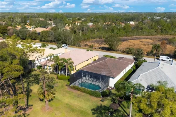 an aerial view of a house with a lake view
