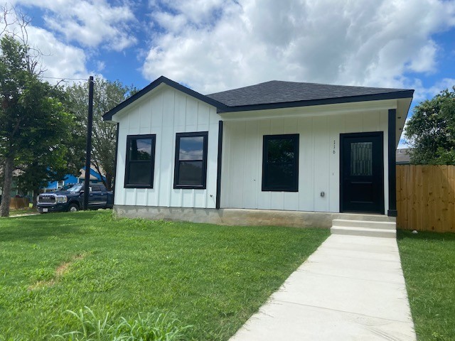 116 Field Street Luling, TX 78648 - Photo 19 of 33 A newly constructed residence features crisp white siding and dark trim, highlighted by a welcoming concrete pathway.
