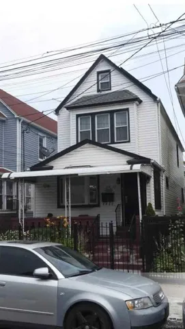 a view of a building with car parked