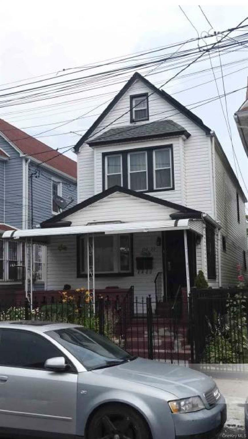 a view of a building with car parked
