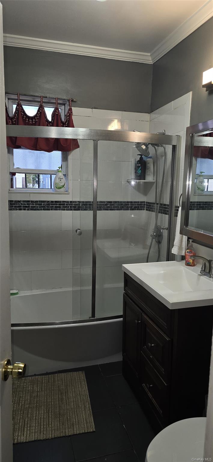 104-23 118th Street Queens, NY 11419 - Photo 3 of 3 a bathroom with a sink and a vanity