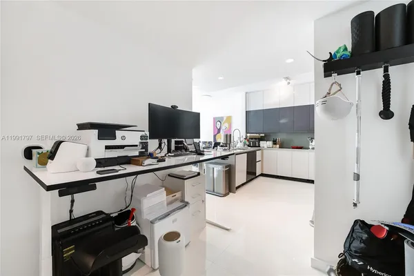 a kitchen with a sink appliances and cabinets