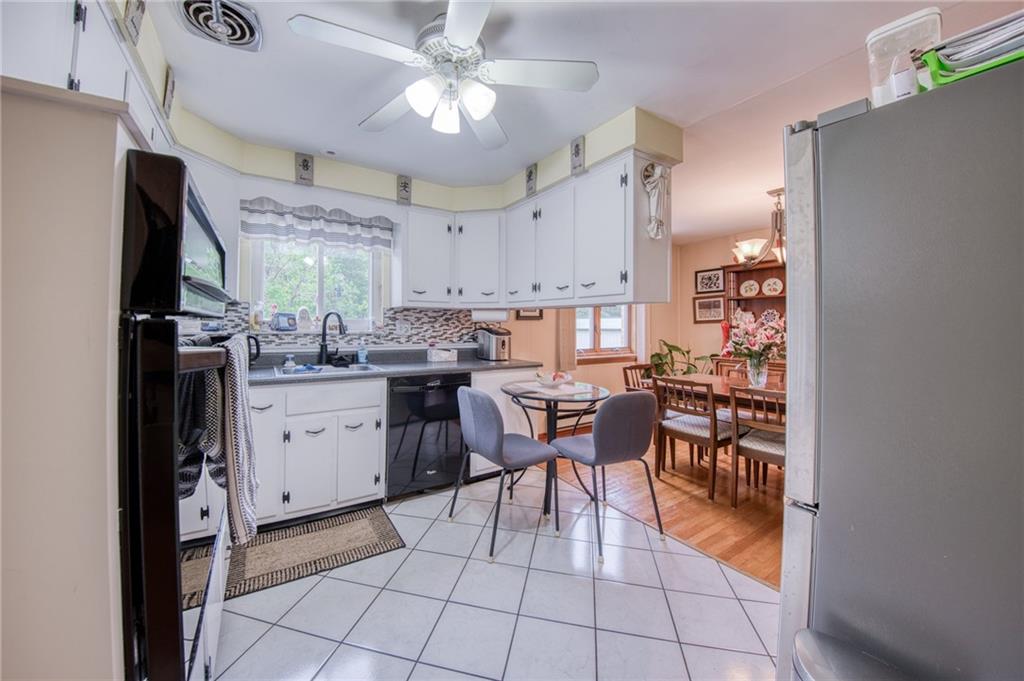 223 Amity Road Glenshaw, PA 15116 - Photo 11 of 42 Ceramic flooring and ceiling fan with a view to the dining room