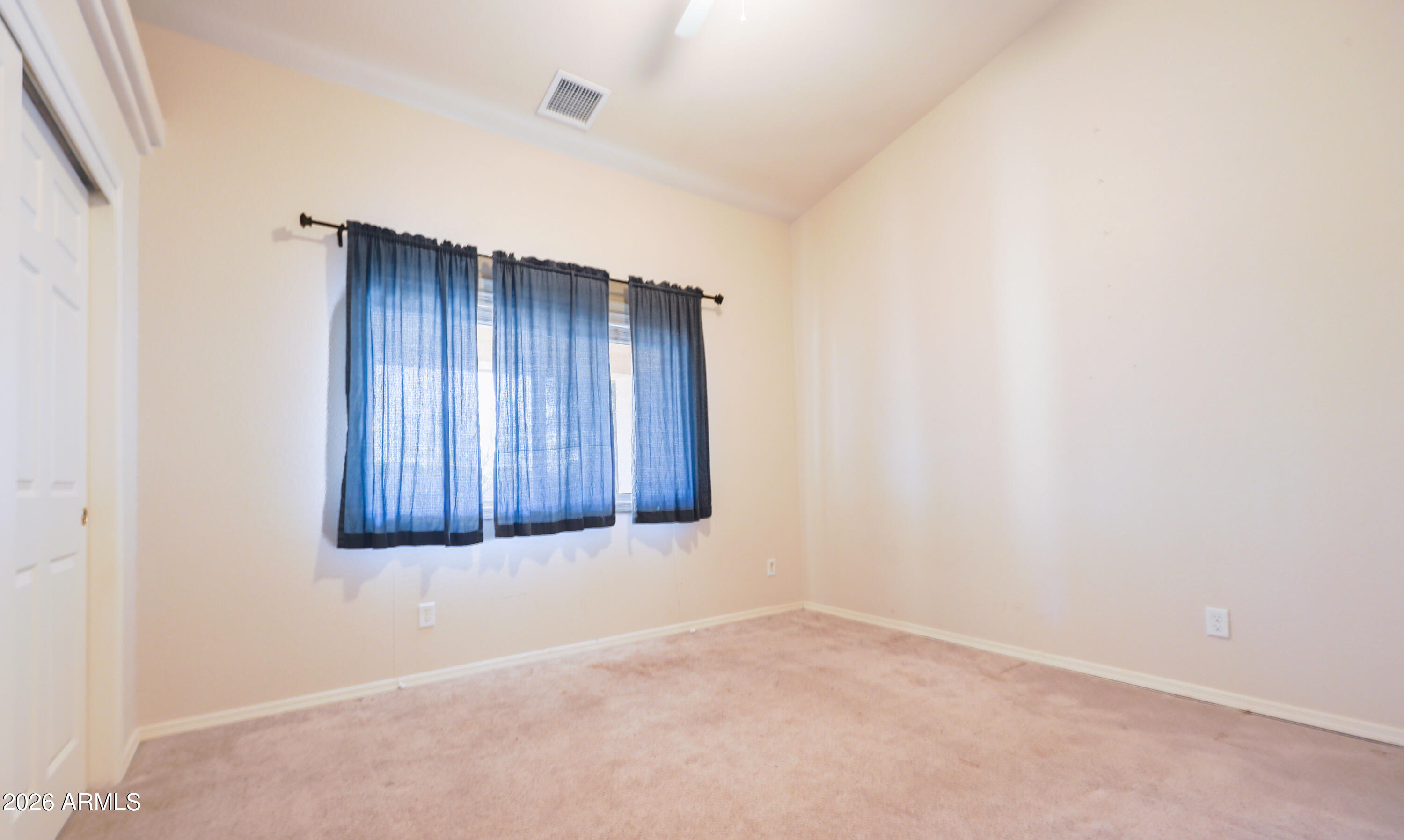 10148 South Airstrip Road Hereford, AZ 85615 - Photo 20 of 36 an empty room with wooden floor and windows