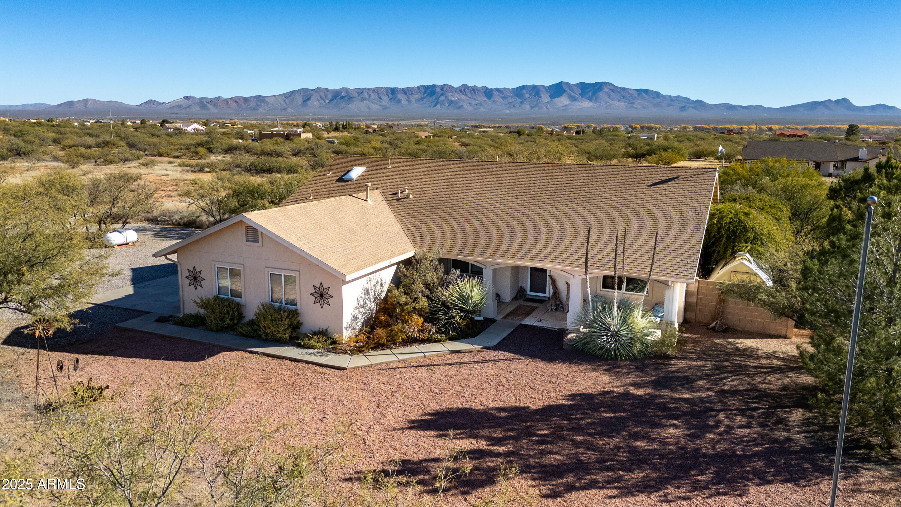 10148 South Airstrip Road Hereford, AZ 85615 - Photo 31 of 36 a view of a house with a yard and a large window