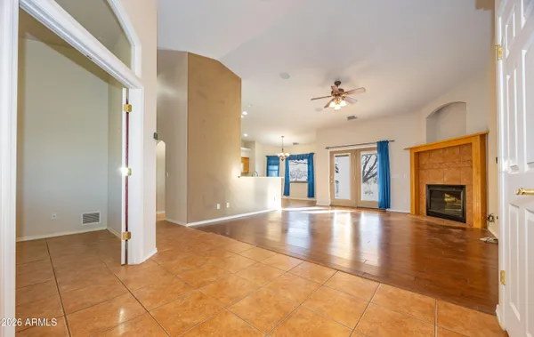 a view of an empty room with windows
