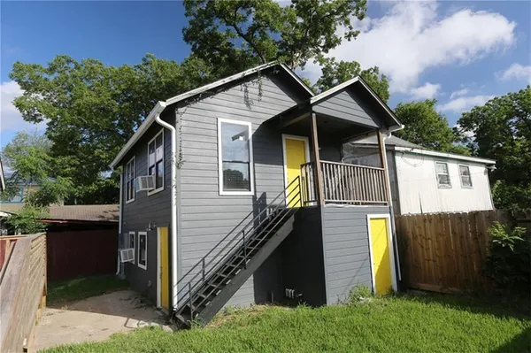 a front view of a house with garage