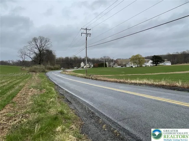 a view of a garden with a lake view