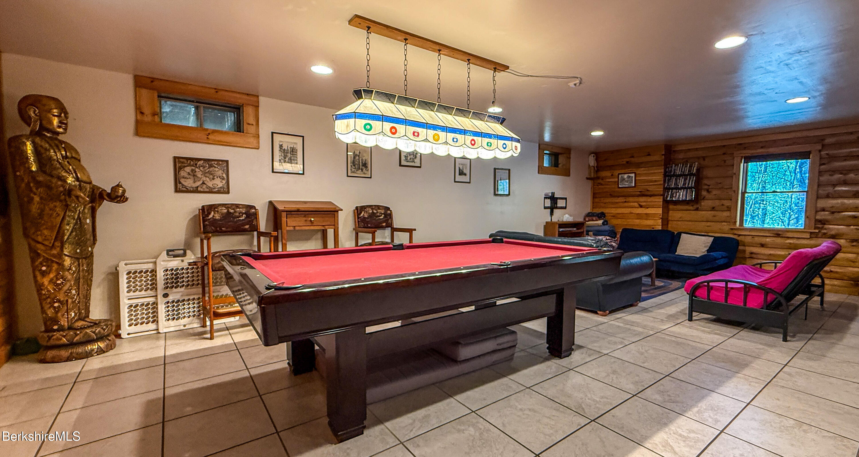 233 Algerie Road Becket, MA 01223 - Photo 38 of 48 a room with pool table a flat screen tv and windows