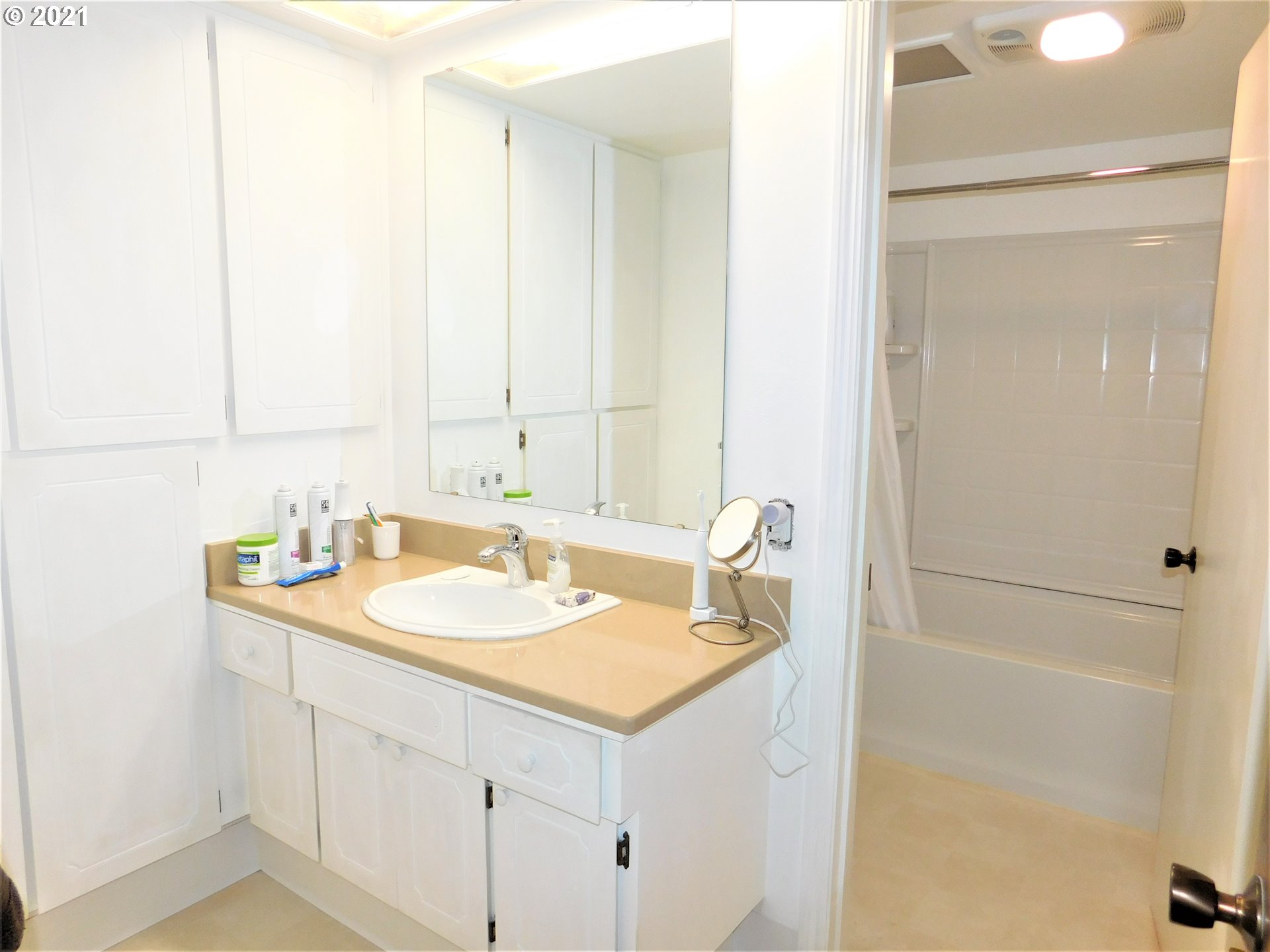 904 65th Street Springfield, OR 97478 - Photo 22 of 30 a bathroom with a sink and a mirror
