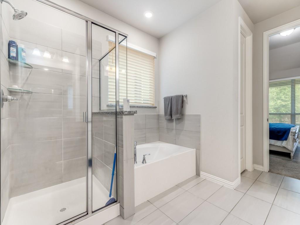 1608 Carnation Street Prosper, TX 75078 - Photo 18 of 25 a spacious bathroom with a bathtub and a shower