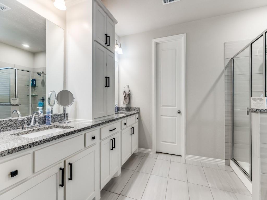 1608 Carnation Street Prosper, TX 75078 - Photo 19 of 25 a bathroom with a granite countertop double vanity sink and mirror