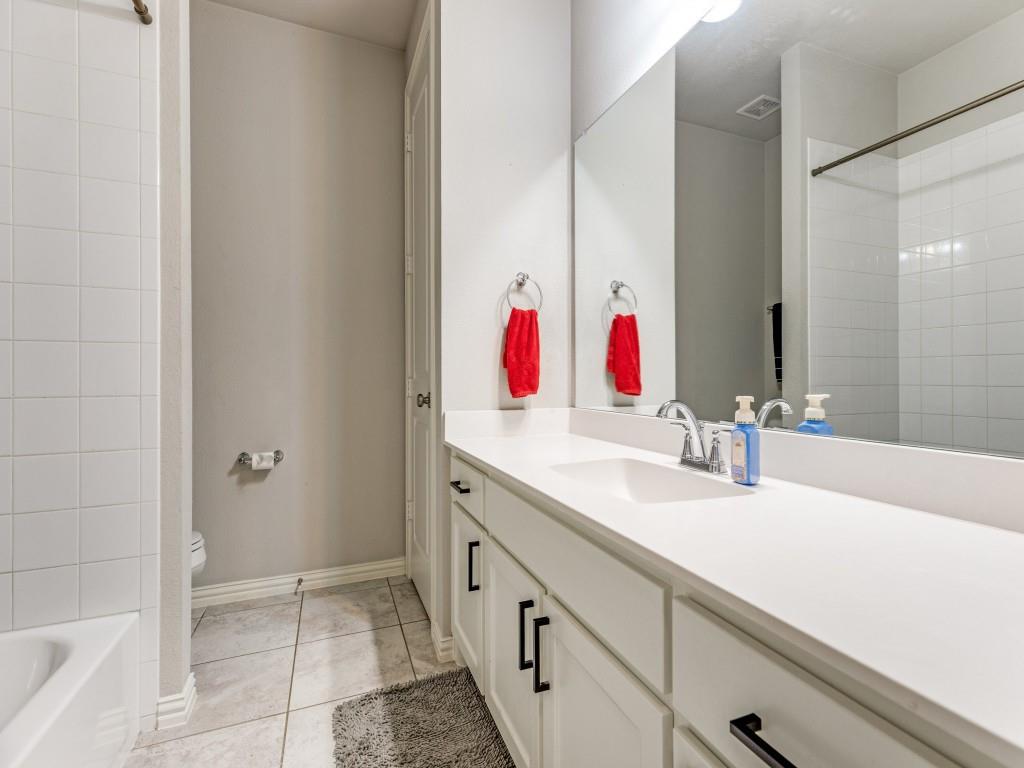 1608 Carnation Street Prosper, TX 75078 - Photo 21 of 25 a bathroom with a sink and a mirror