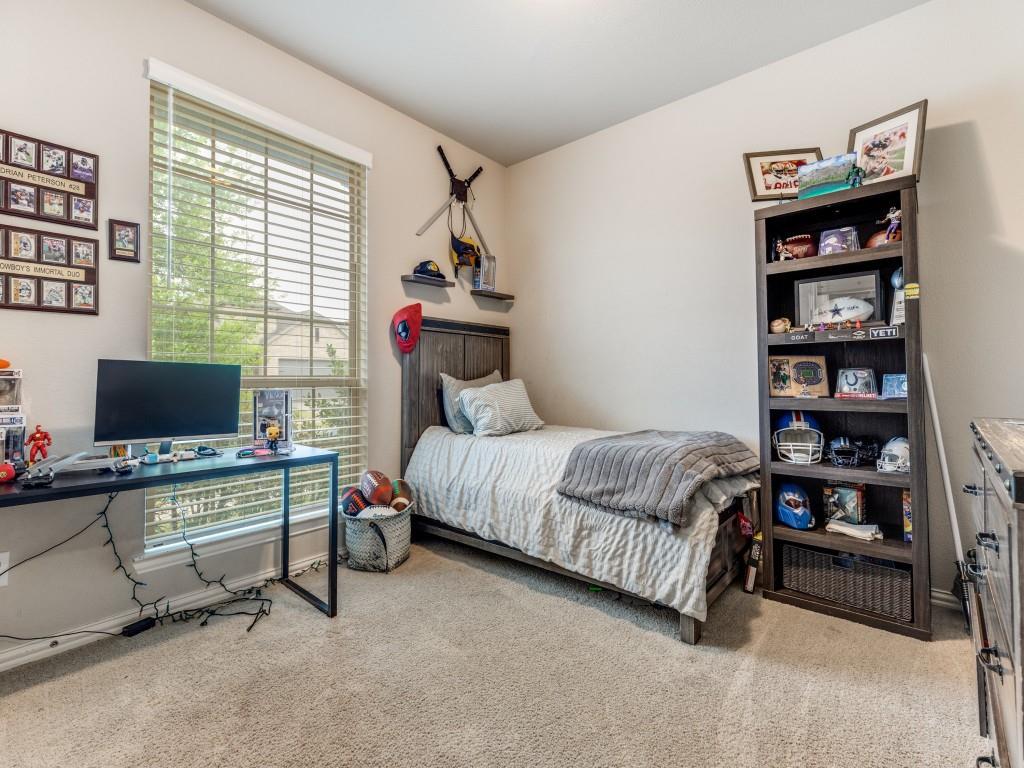 1608 Carnation Street Prosper, TX 75078 - Photo 22 of 25 a bedroom with a bed and a computer on a desk next to a window