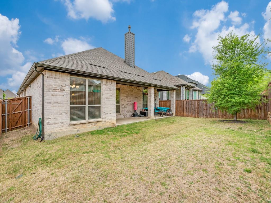 1608 Carnation Street Prosper, TX 75078 - Photo 25 of 25 a front view of a house with a garden