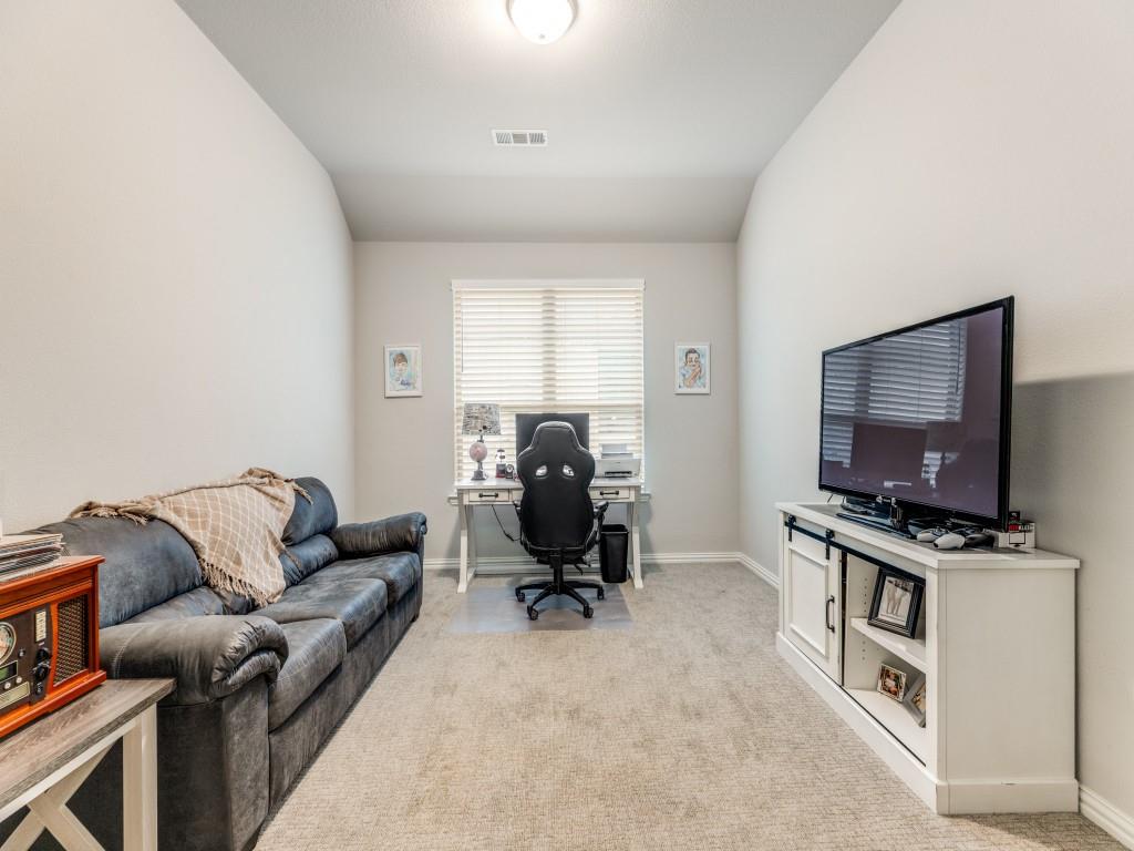 1608 Carnation Street Prosper, TX 75078 - Photo 5 of 25 a living room with furniture and a flat screen tv