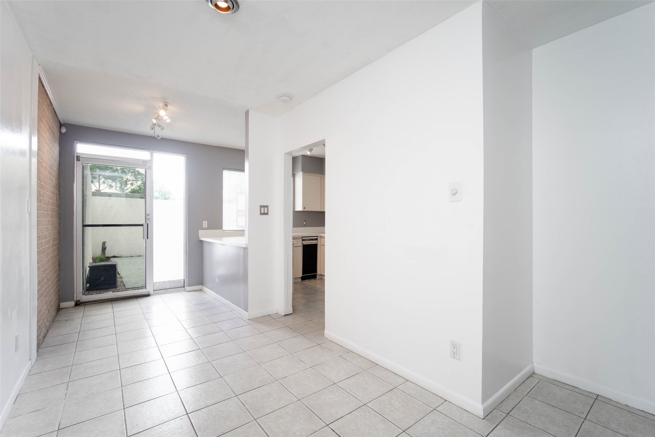 6311 Riverview Way Houston, TX 77057 - Photo 14 of 35 a view of a kitchen with refrigerator and an empty space