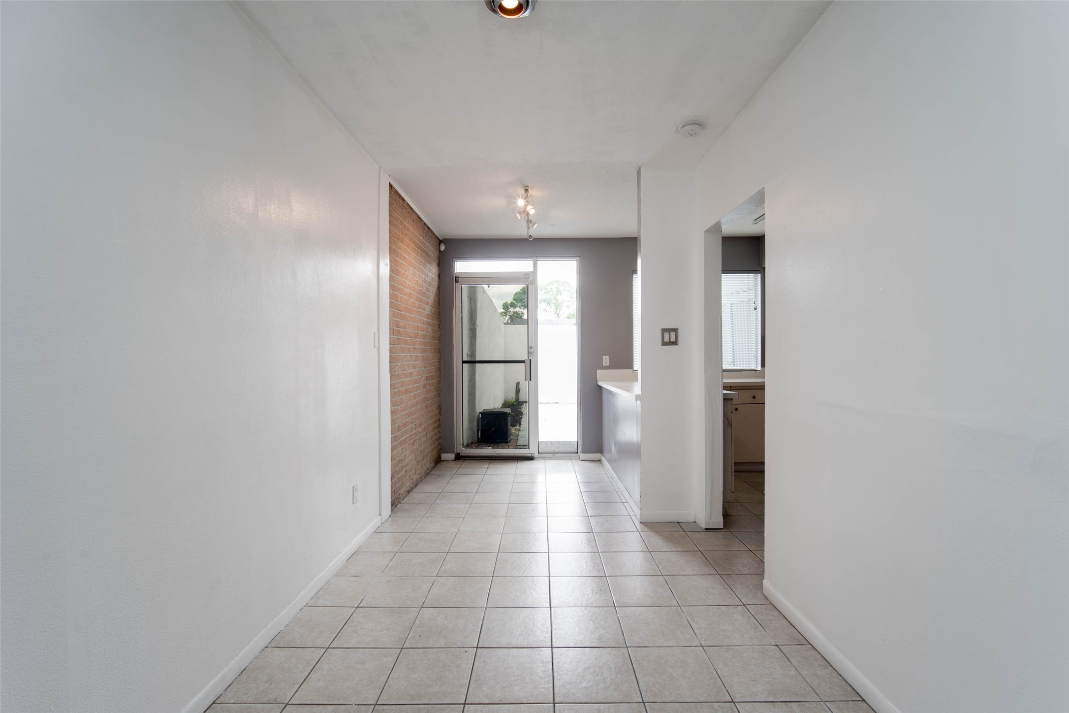 6311 Riverview Way Houston, TX 77057 - Photo 16 of 35 a view of a hallway with wooden shelves