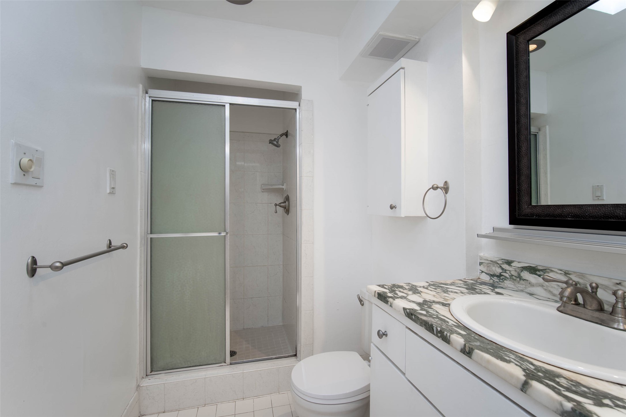 6311 Riverview Way Houston, TX 77057 - Photo 24 of 35 a bathroom with a sink toilet and shower