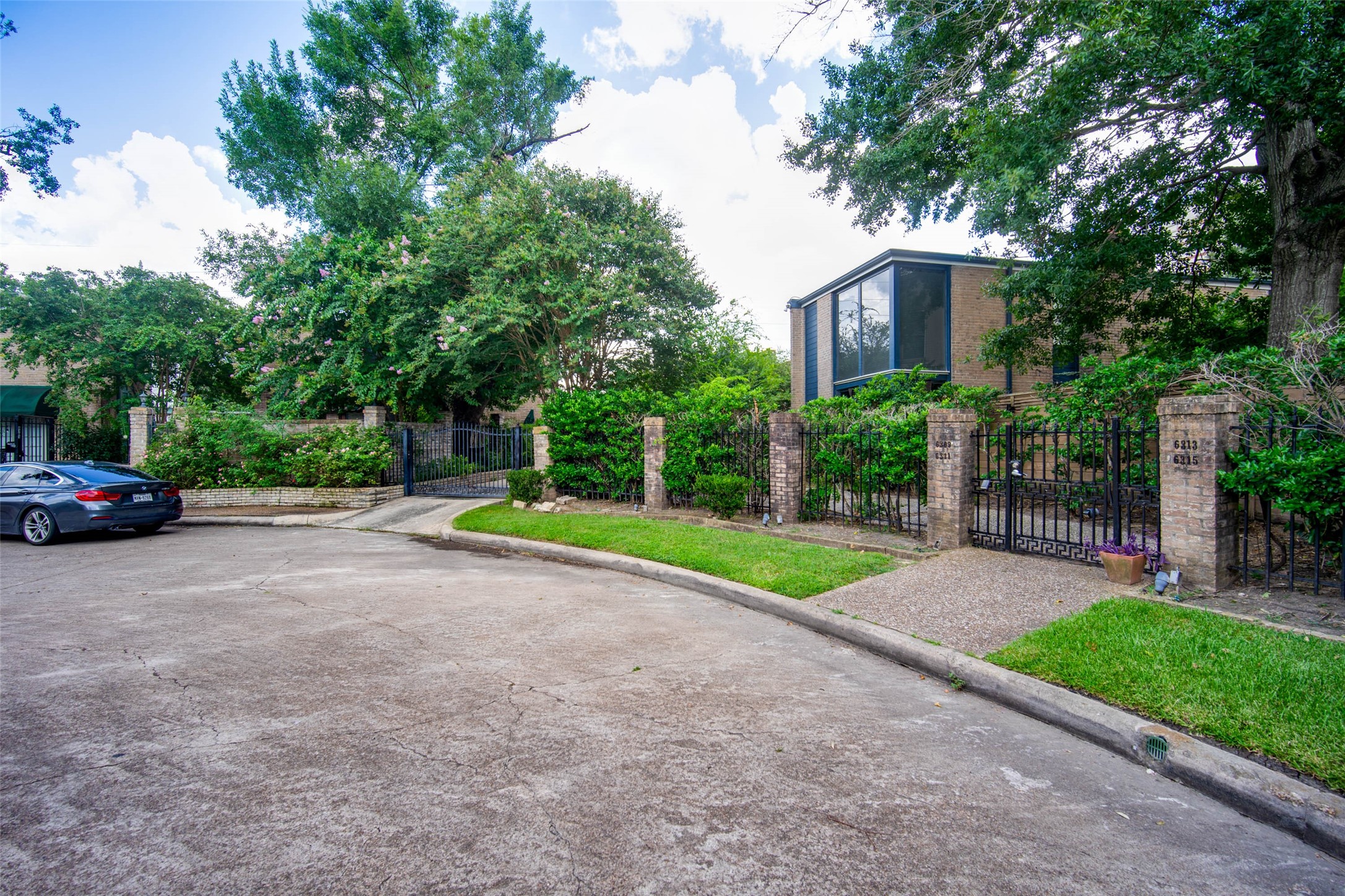 6311 Riverview Way Houston, TX 77057 - Photo 35 of 35 a view of a house with a big yard and large trees