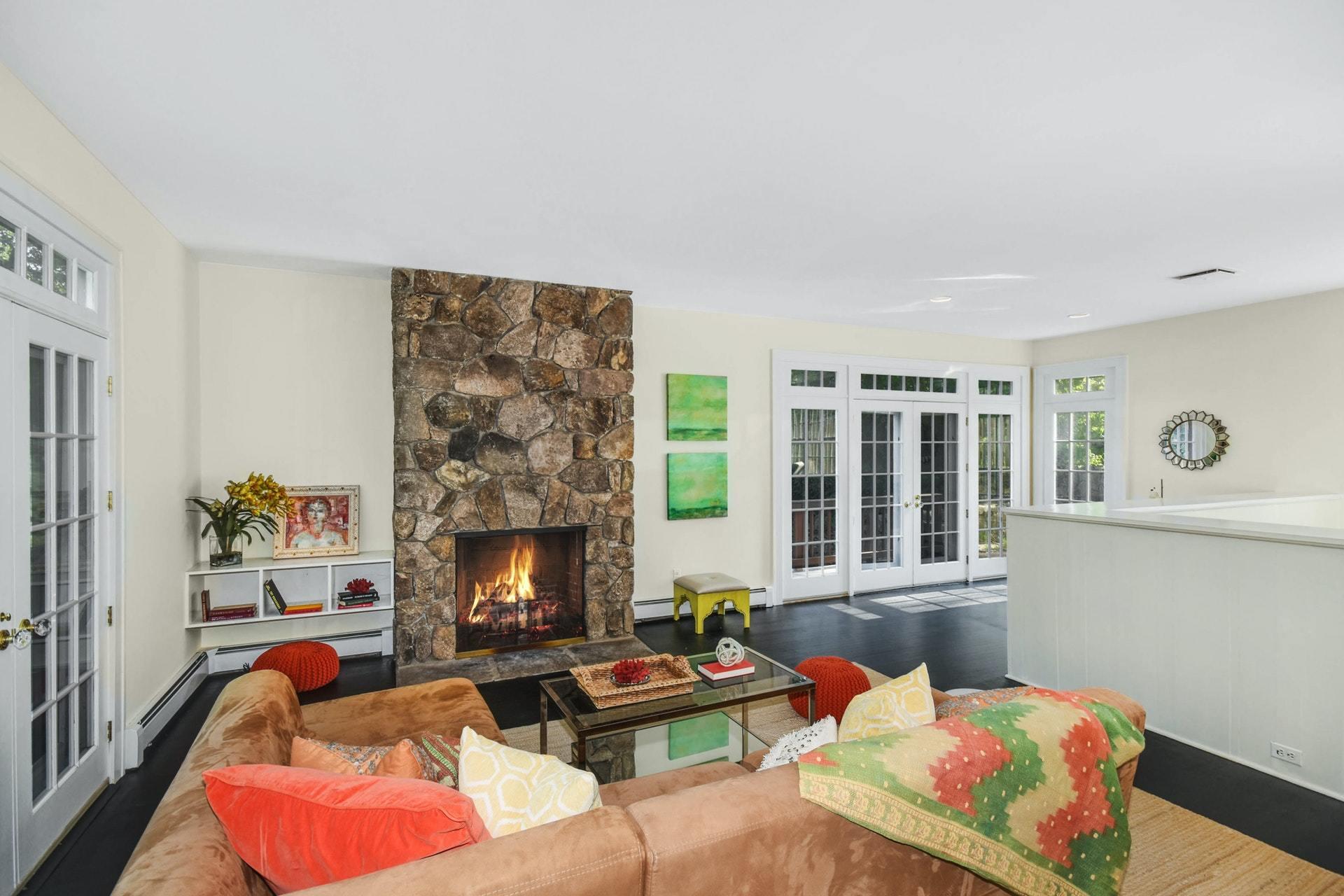 221 Mill Road New Canaan, CT 06840 - Photo 14 of 32 a living room with furniture and a fireplace