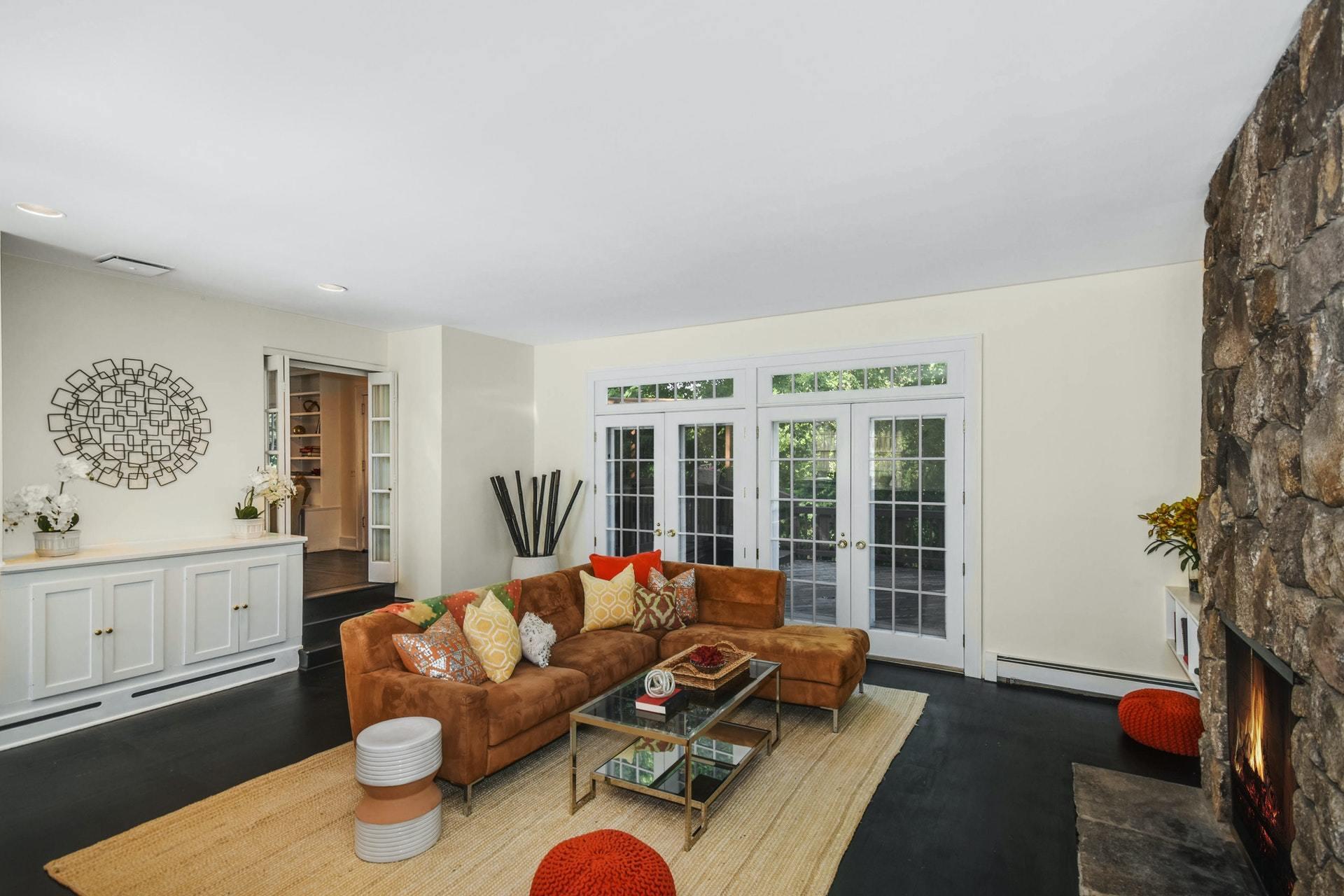 221 Mill Road New Canaan, CT 06840 - Photo 16 of 32 a living room with furniture and a potted plant