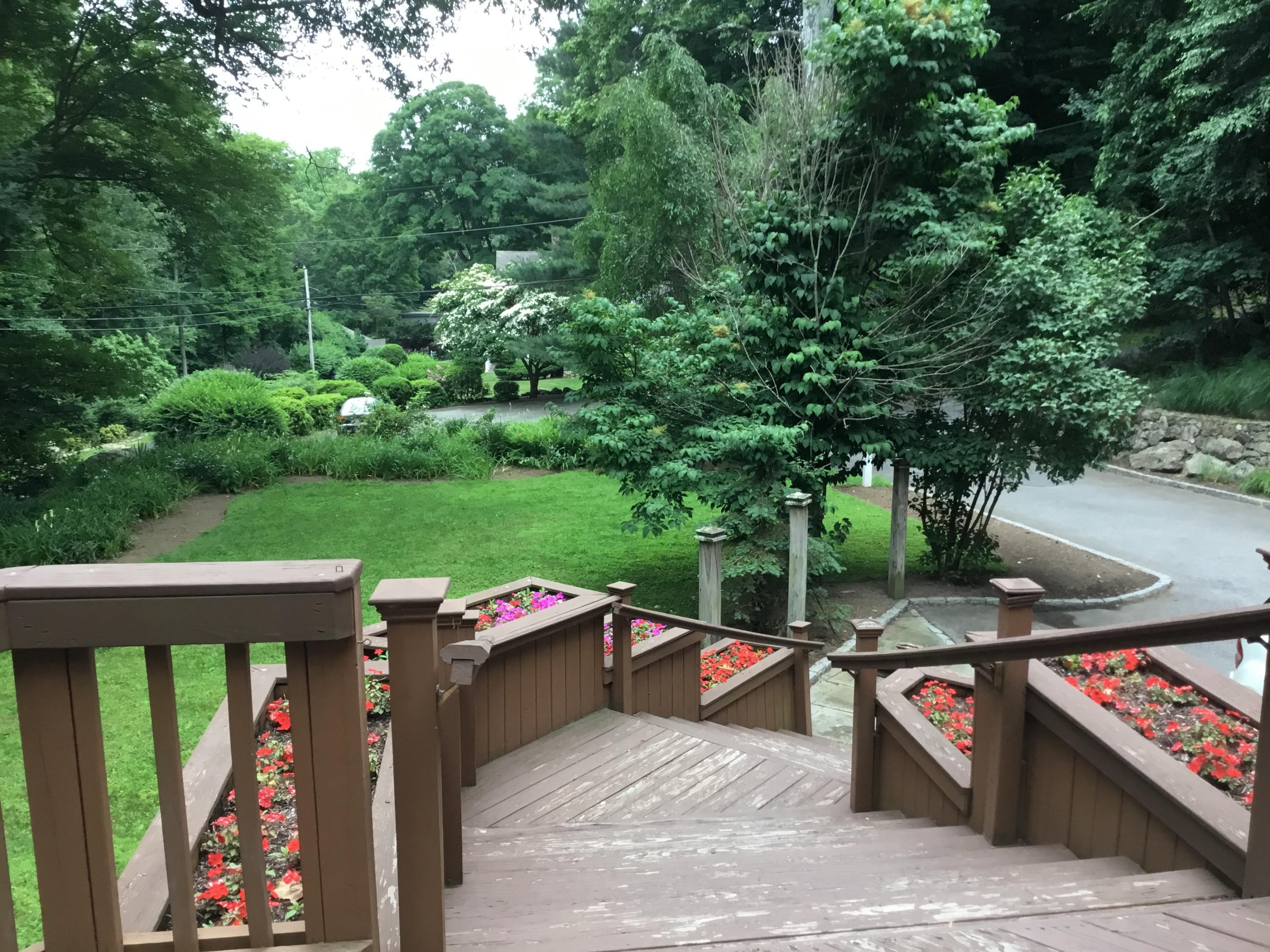 221 Mill Road New Canaan, CT 06840 - Photo 2 of 32 an outdoor space with seating