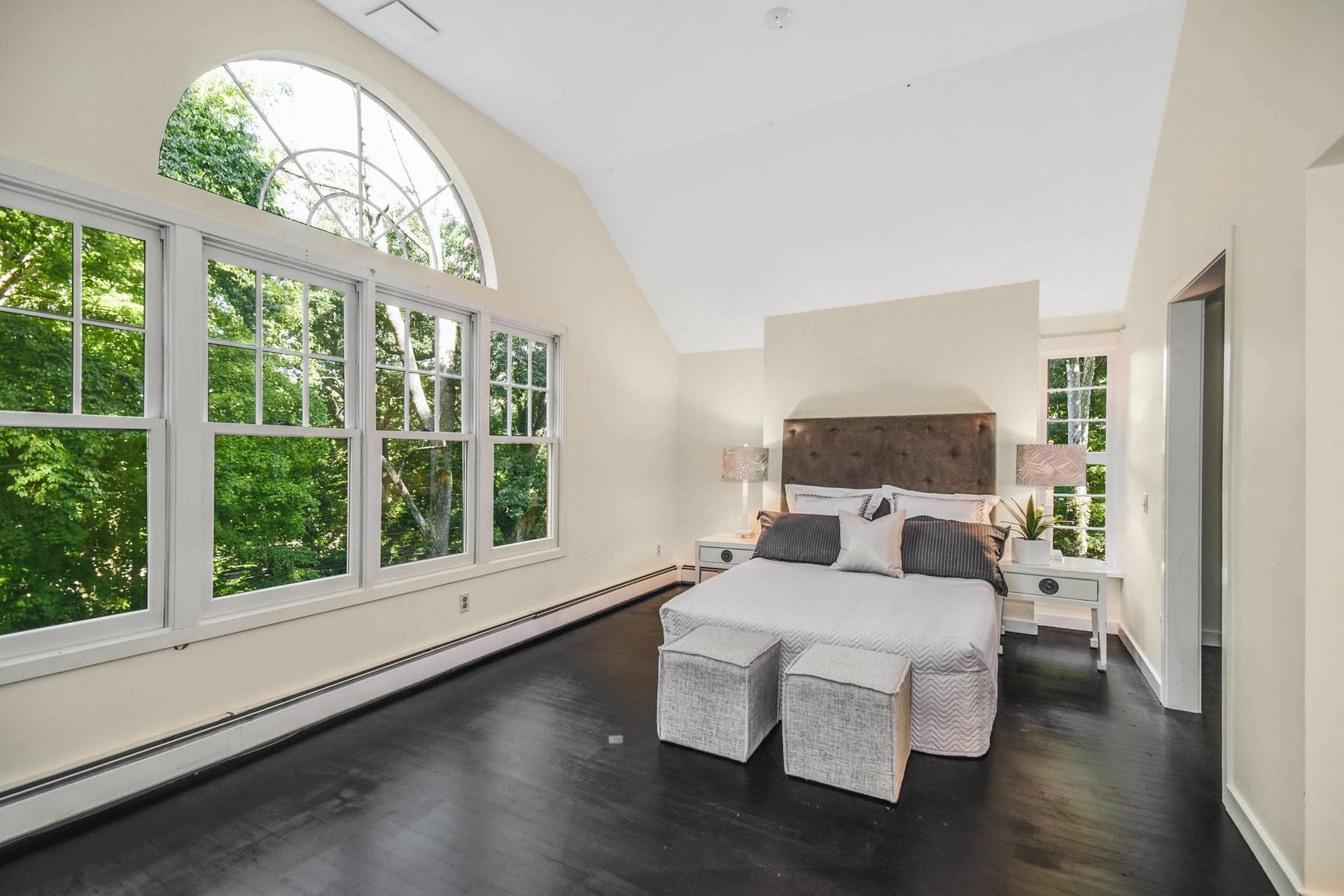 221 Mill Road New Canaan, CT 06840 - Photo 21 of 32 a bedroom with furniture and a large window